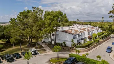 an aerial view of a large white building at The Palm Nest