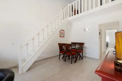 an empty room with a door and a window at Casa Sol Dourado in Albufeira