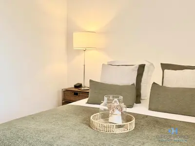 a living room with a couch and a coffee table at Villa Rosal 21 in Albufeira