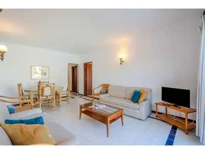 a dining room with a glass table and chairs at Apartment Rita - Sunny Way by Interhome in Albufeira