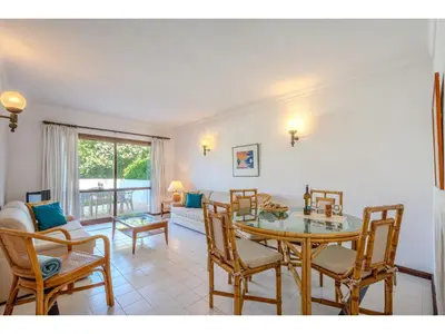 a living room with a couch and a table at Apartment Rita - Sunny Way by Interhome in Albufeira