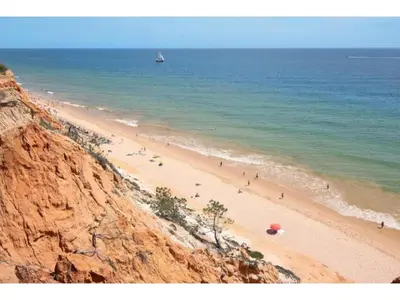 a group of people on a beach near the ocean at Apartment Jade-Sunny Way by Interhome in Albufeira
