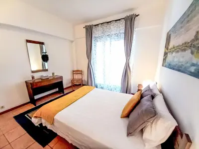 a living room with a couch and a tv at Apartment Joyce - Sunny Way by Interhome in Albufeira