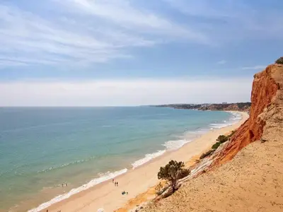 a group of people on a beach near the ocean at Apartment Kaya- Sunny Way by Interhome in Albufeira