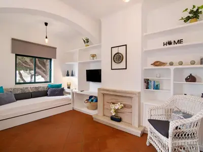 a kitchen with white cabinets and a wooden counter top at Apartment Medusa - Sunny Way by Interhome in Albufeira