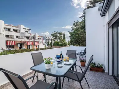 a patio with a table and chairs on a balcony at Apartment Patrick - Sunny Way by Interhome in Albufeira