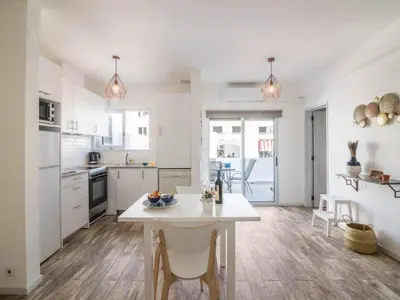 a kitchen with white cabinets and a stove top oven at Apartment Patrick - Sunny Way by Interhome in Albufeira