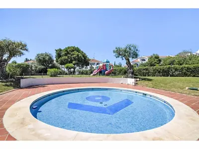 a swimming pool with a slide in a park at Apartment Max Tropical - Sunny Way by Interhome in Albufeira