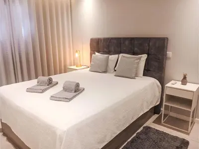 a bedroom with a large bed with towels on it at Apartment Sunlight Albufeira - Sunny Way by Interhome in Albufeira