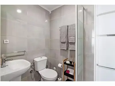 a bathroom with a toilet and a sink and a shower at Apartment W Marina - Sunny Way by Interhome in Albufeira