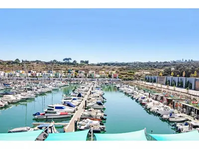 a bunch of boats docked in a harbor at Apartment W Marina - Sunny Way by Interhome in Albufeira