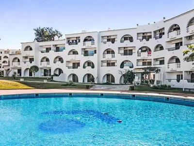 a swimming pool in front of a building at Apartment Albufeira Prestige - Sunny Way by Interhome in Albufeira