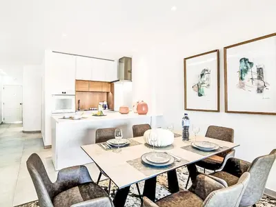 a kitchen and dining room with a table and chairs at Apartment Albufeira Prestige - Sunny Way by Interhome in Albufeira