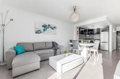 a living room with a couch and a table at Quiet & Sea in Albufeira