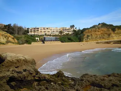 two chairs on a balcony with a view of a bridge at 5-minute walk to Aveiros Beach in Albufeira