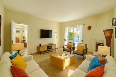 a living room with a couch and a table at Villa Mar by Sunny Deluxe in Albufeira