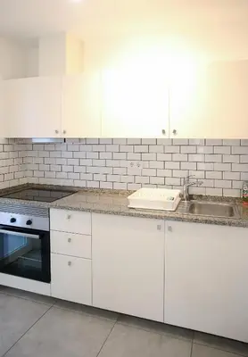 a bathroom with a sink and a toilet and a shower at Casa Tomás in Faro