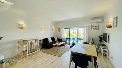 a living room with a couch and a table at Jardim da Oura by Check-in, Portugal in Albufeira
