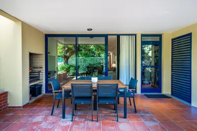 a dining room with a table and chairs at F5 Vila Sol AI Pool & Golf in Vilamoura in Quarteira