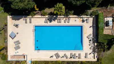 an overhead view of a large swimming pool at F5 Vila Sol Q Pool & Golf in Vilamoura in Quarteira