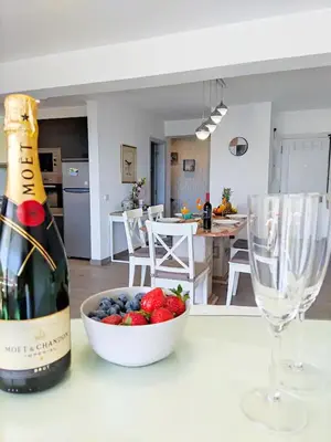 a kitchen with a plate of fruit on a counter at Sunny Condo facing the pool by Algarve Dream Holidays in Quarteira