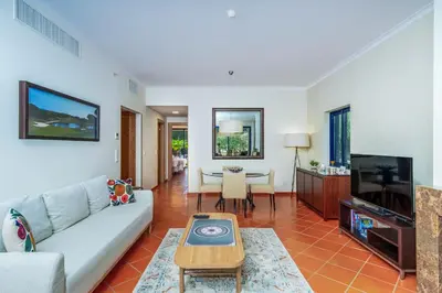 a living room with a couch and a table at F5 Vila Sol AP Pool & Golf in Vilamoura in Quarteira