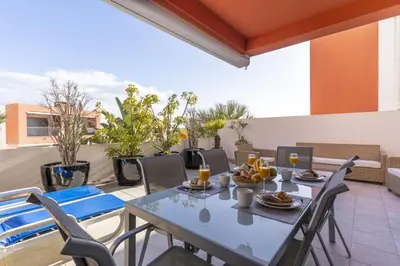 a living room with a couch and a table at #354 Vitismar AU by Home Holidays in Guia