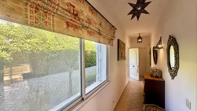 a hallway with a large window in a house at Pinheiro Manso by Check-in Portugal in Albufeira