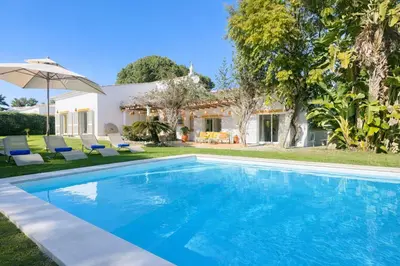 an image of a swimming pool in front of a house at Pinheiro Manso by Check-in Portugal in Albufeira