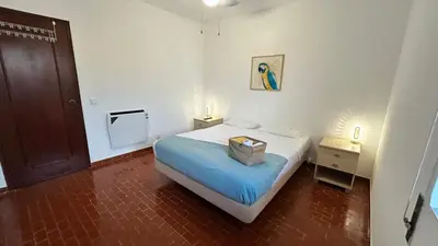 a bedroom with a bed with a box on it at Blife Josya private apartment at Faro beach in Faro
