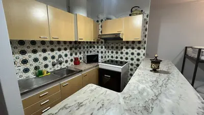 a kitchen with a marble counter top at Blife Josya private apartment at Faro beach in Faro