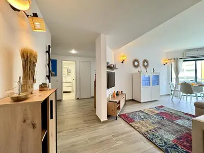 a large living room with a kitchen and a dining room at Vilamoura Central Beach 1 With Pool by Homing in Vilamoura