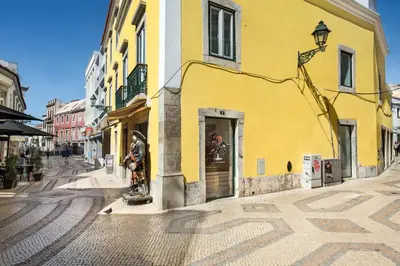 an empty street in a city with buildings at Faro Downtown in Faro