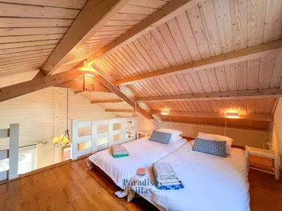 a bedroom with a large bed in an attic at 7 Bedrooms, Main House, Bungalow, Private Pool in Fonte da Murta