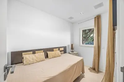 a bedroom with a large bed in a room with a window at Villa Gale by Vintage Travel in Galé
