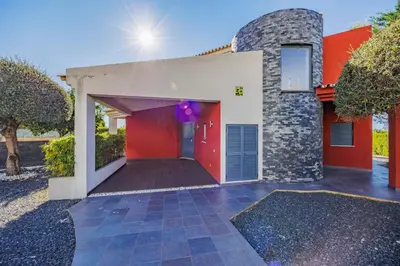 a red and white house with a red garage at Villa Gale by Vintage Travel in Galé