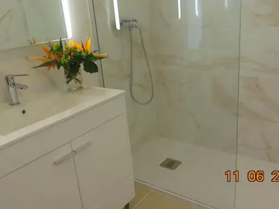 a bathroom with a shower and a sink and a toilet at Apartment NASCER-DO-SOL by Interhome in Quarteira