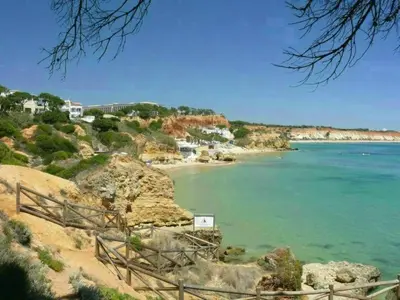 a view of a beach with houses and the ocean at Apartment Wohnung mit Terrasse by Interhome in Albufeira