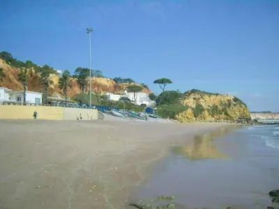 a view of a beach with the ocean and houses at Apartment Wohnung mit Terrasse by Interhome in Albufeira