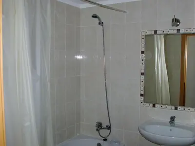 a bathroom with a shower and a sink and a mirror at Apartment Wohnung mit Terrasse by Interhome in Albufeira