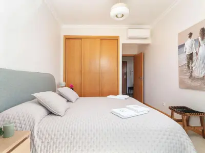 a bedroom with a white bed in a room at Apartment Elena 2 mit Blick auf das Wasser by Interhome in Albufeira