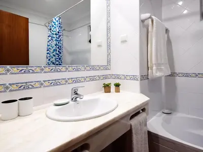 a bathroom with a sink and a mirror at Holiday Home Lotus Villa- Albufeira by Interhome in Albufeira