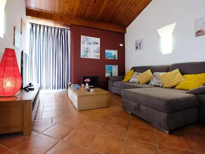 a living room with a couch and a table at Holiday Home Lotus Villa- Albufeira by Interhome in Albufeira