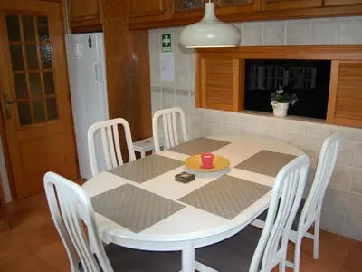 a table and chairs in a kitchen with a table and a table and a table at Holiday Home Villa Monte Alegrete by Interhome in Loulé