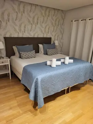a bedroom with two beds with towels on them at Garden Hill Haven - Old Town Albufeira - Sea View in Albufeira