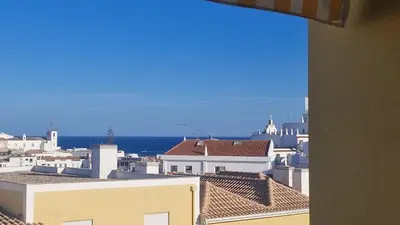 a view of the roofs of buildings in a city at Garden Hill Haven - Old Town Albufeira - Sea View in Albufeira
