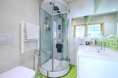 a bathroom with a sink and a mirror at Garden Hill Haven - Old Town Albufeira - Sea View in Albufeira