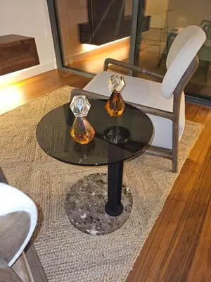 a black table with two glasses and a chair at Apartamento Platinum in Faro