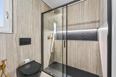 a bath tub with a faucet in a bathroom at Casa Mimosa in Vale do Lobo
