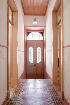 an empty hallway with a door and a tile floor at Casa 1923 by MY CHOICE in Faro